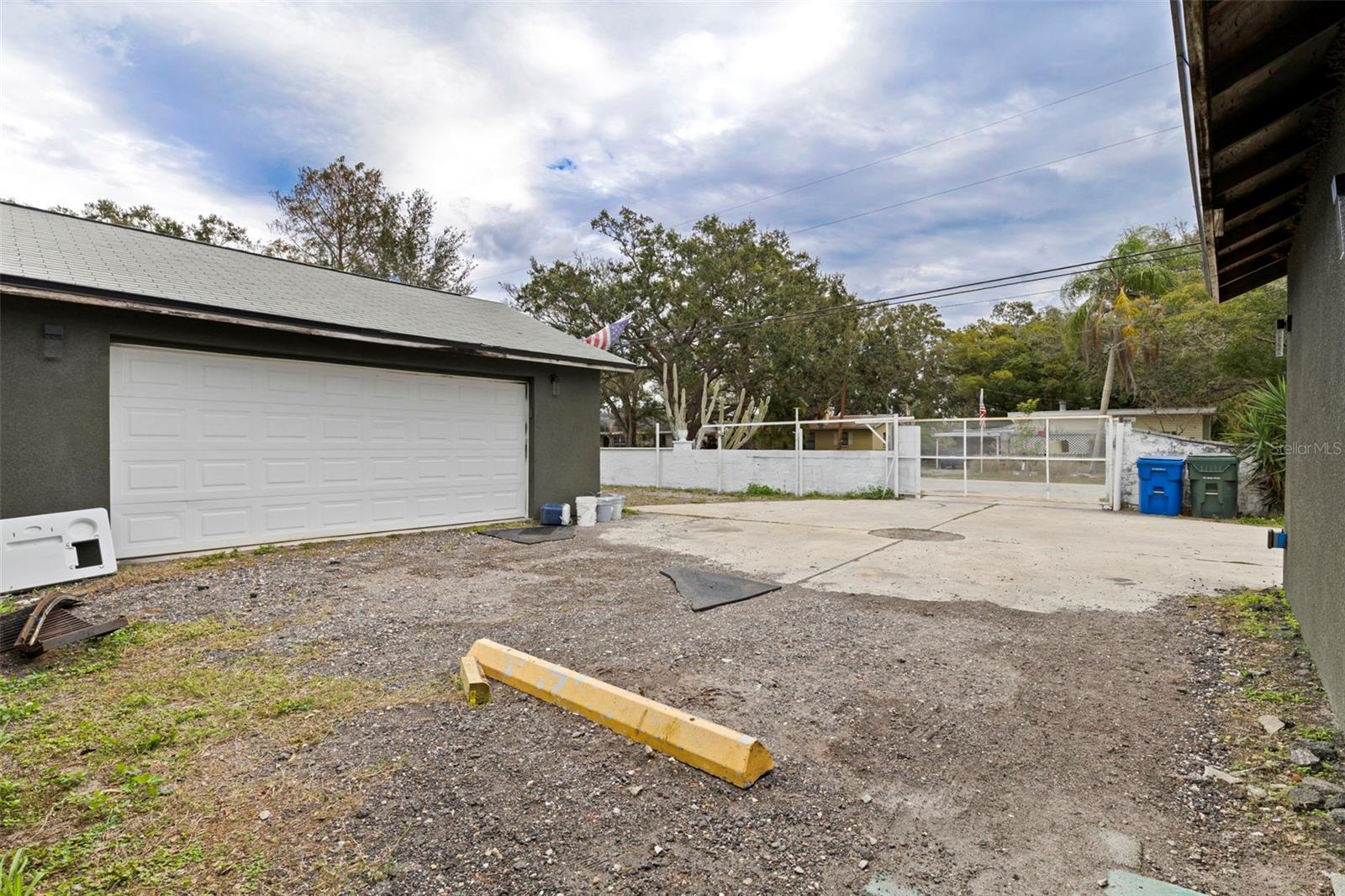 Oversized 3 car garage with tons of attic space for storage.