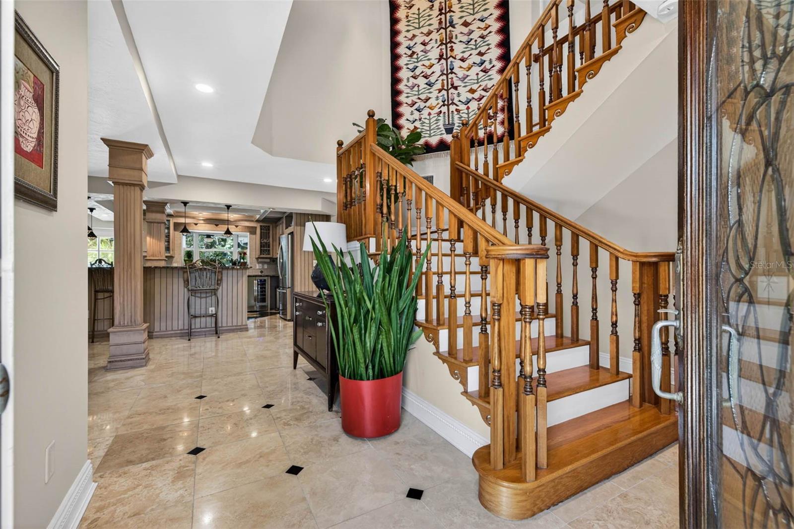 Grand Entrance showing casing the beautiful woodwork on the stairs