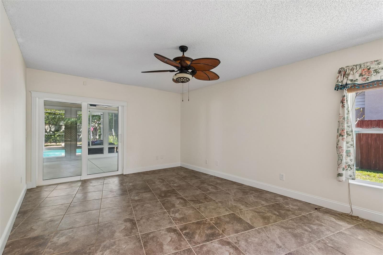 Primary suite with sliding glass doors to the sunroom