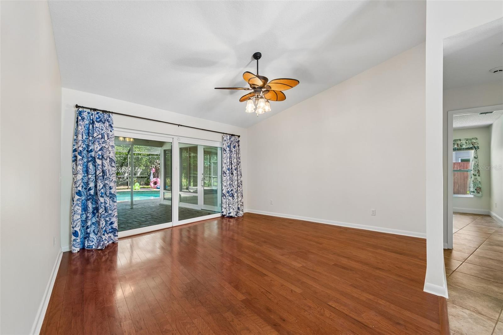 Living room with sliding doors onto the screened in back patio