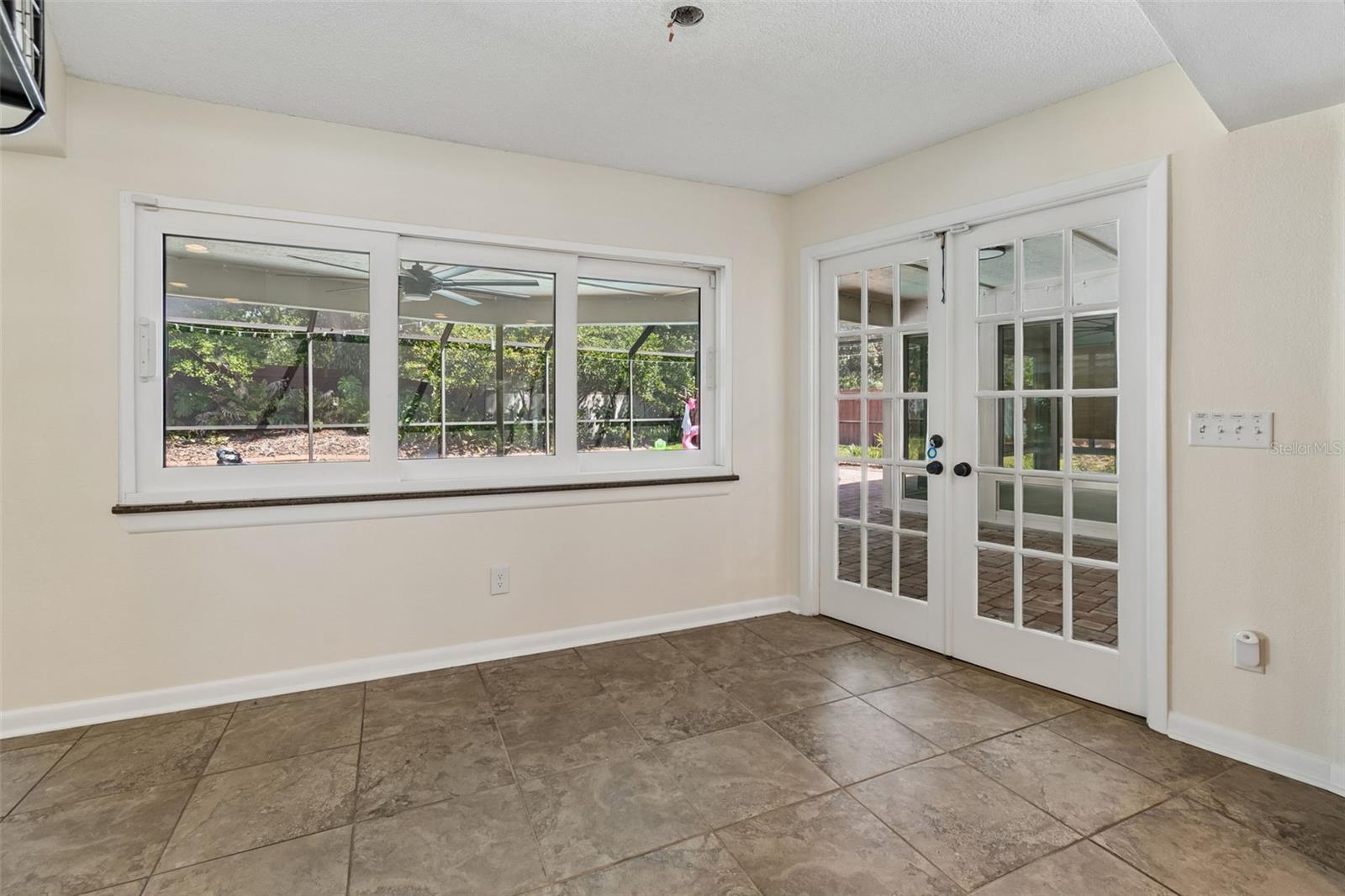 Dinette with French doors that lead to the screened in patio