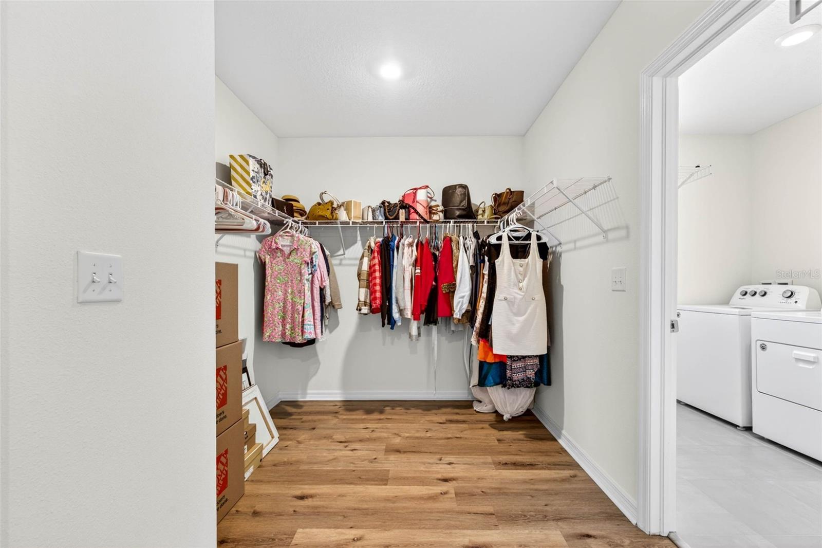 Primary Walk in Closet with Laundry Room access