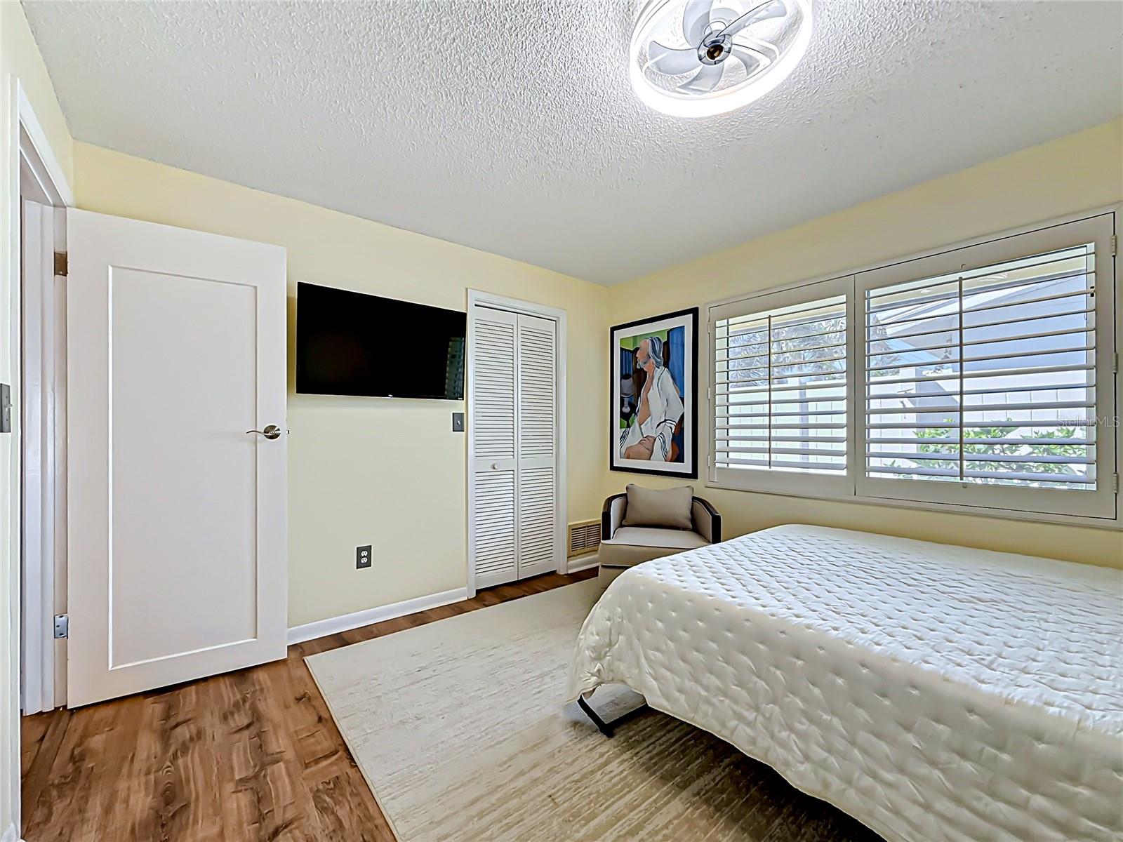 2nd bedroom with queen murphy bed & walk in closet