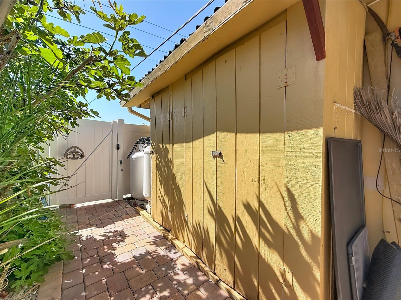 Two propane tanks owned and storage shed
