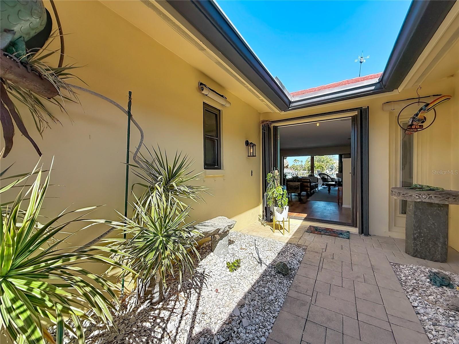As you walk through the front door, you're immediately greeted by a wide, open view of the water.