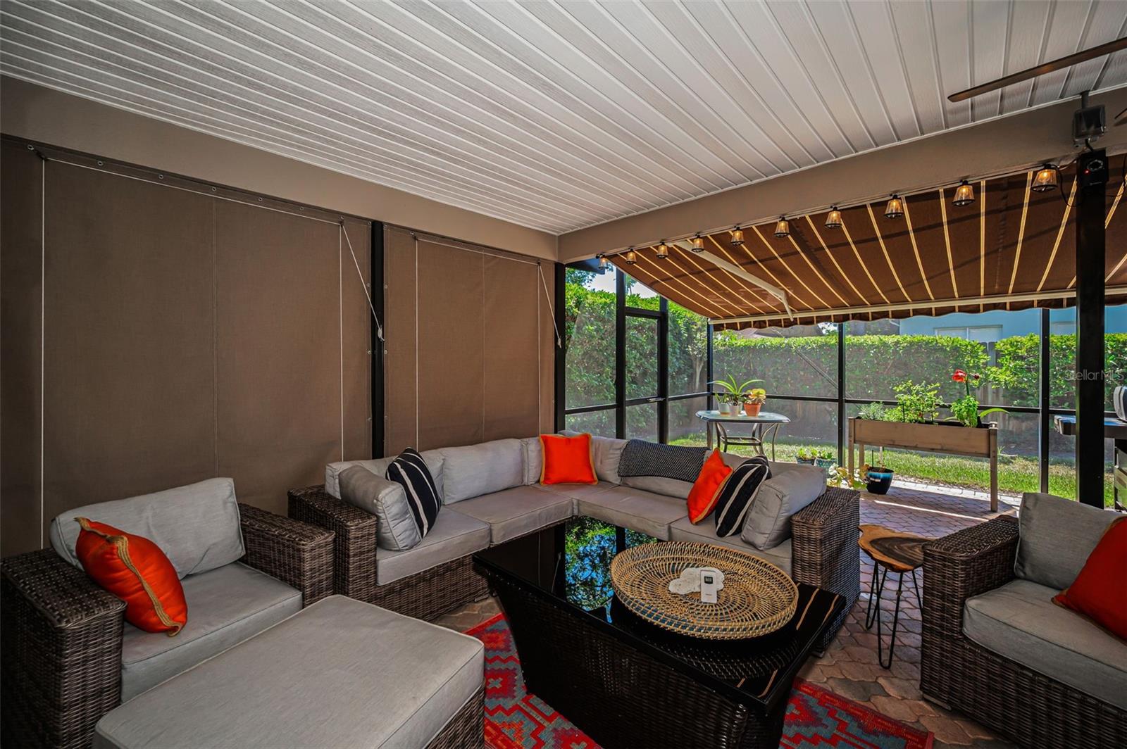 Covered Lanai with Remote Controlled Awning & Privacy Shades