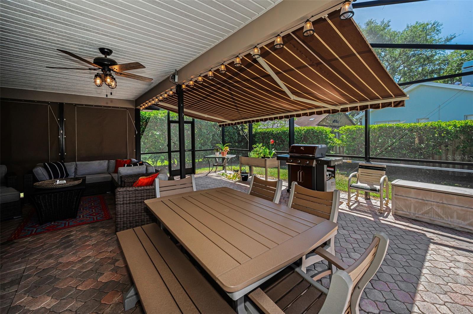 Covered Lanai with Remote Controlled Awning & Privacy Shades
