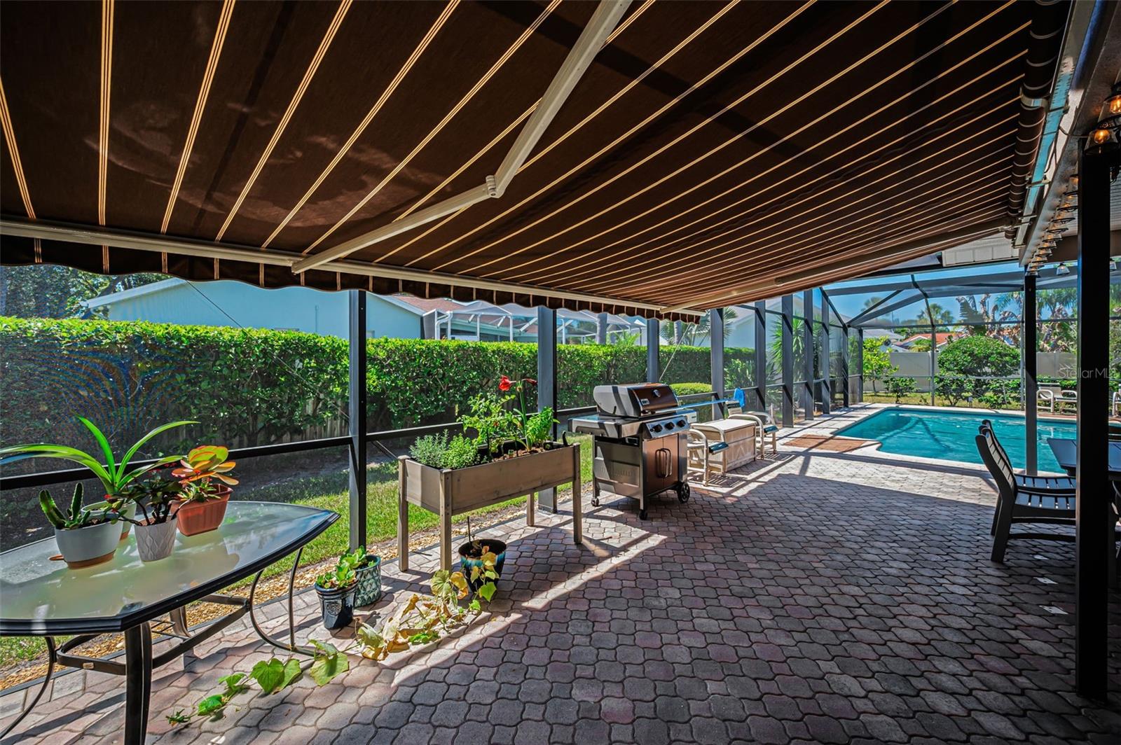 Covered Lanai with Remote Controlled Awning & Privacy Shades