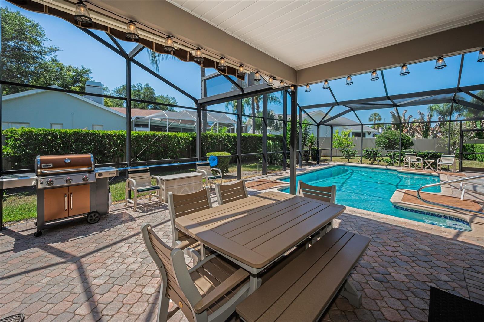 Covered Lanai with Remote Controlled Awning & Privacy Shades