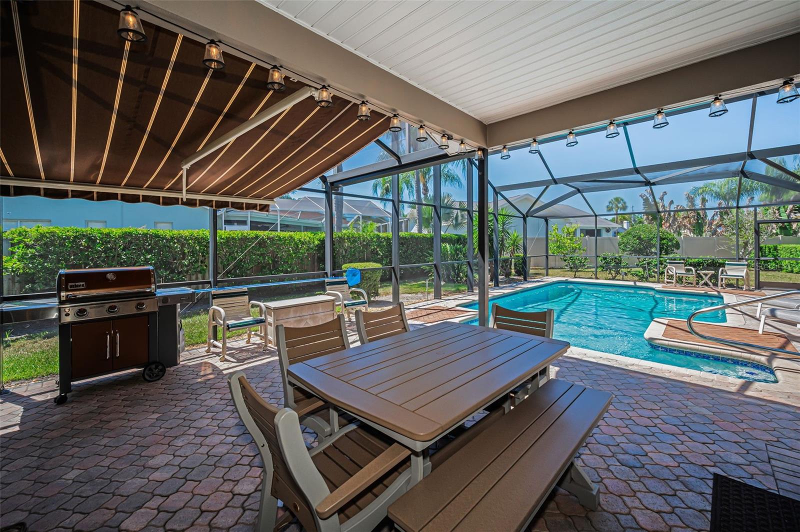 Covered Lanai with Remote Controlled Awning & Privacy Shades