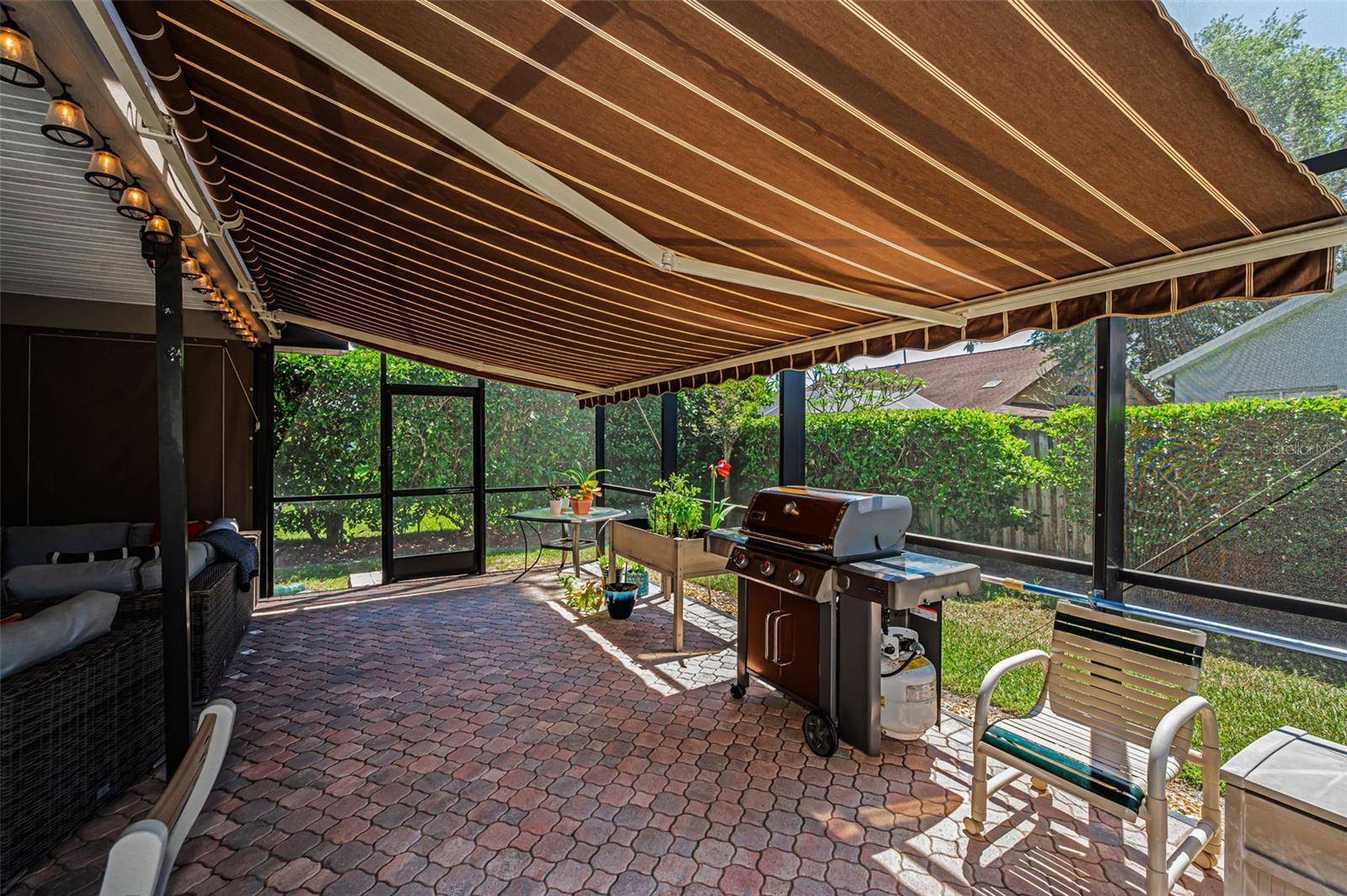 Covered Lanai with Remote Controlled Awning & Privacy Shades