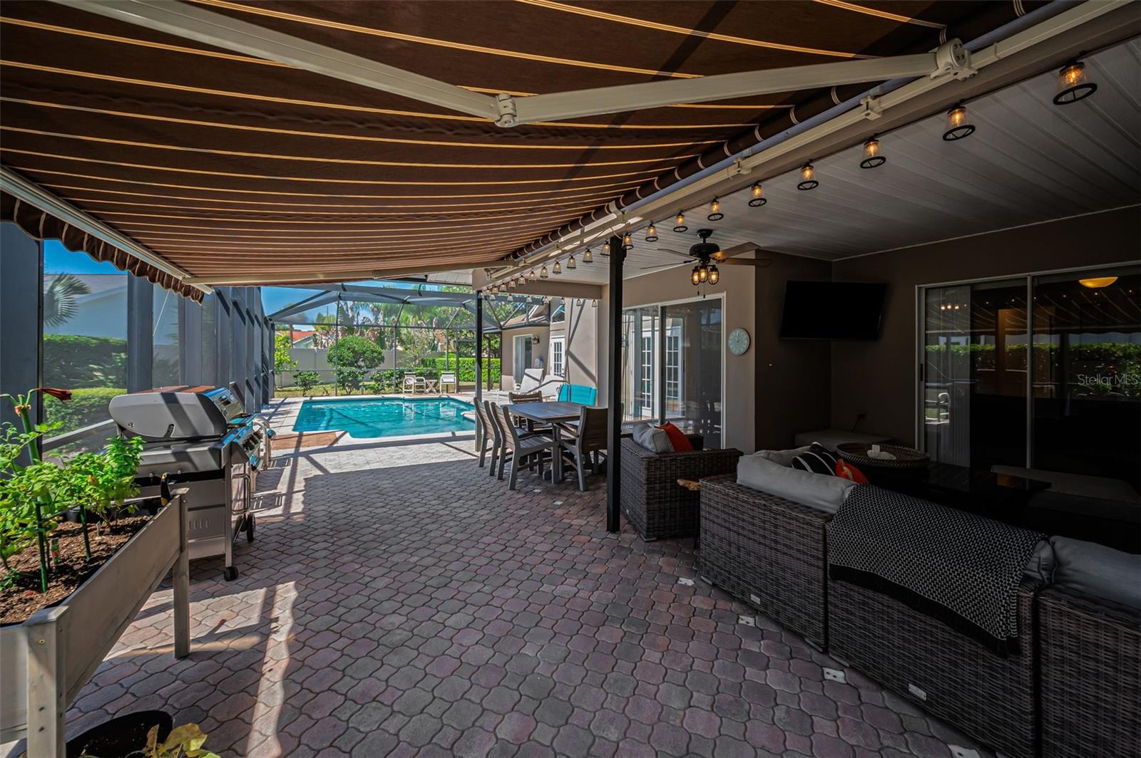 Covered Lanai with Remote Controlled Awning & Privacy Shades