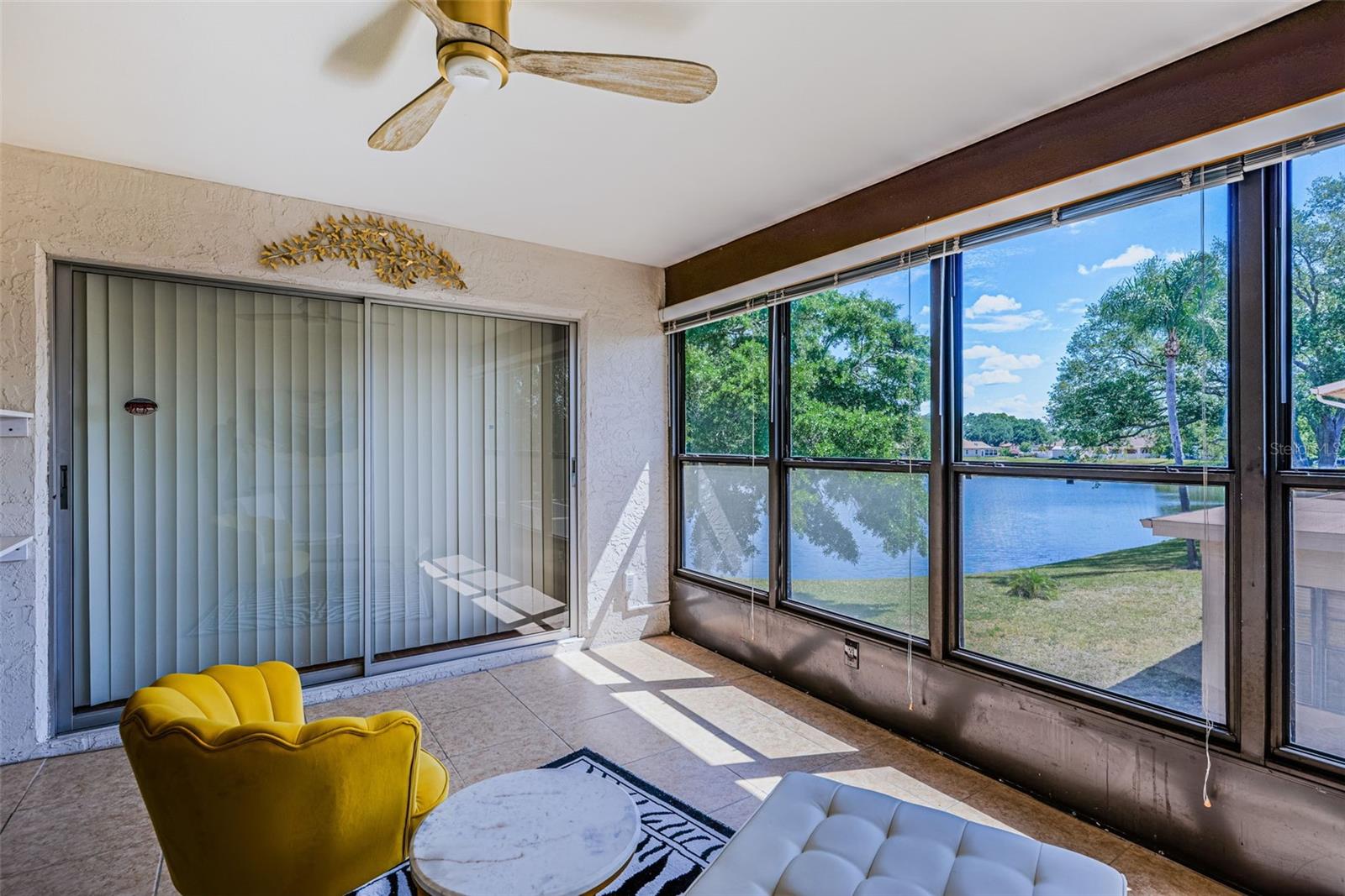 Relax on your Florida Room 13x12 with lovely pond and nature views, along with Ceramic tile.