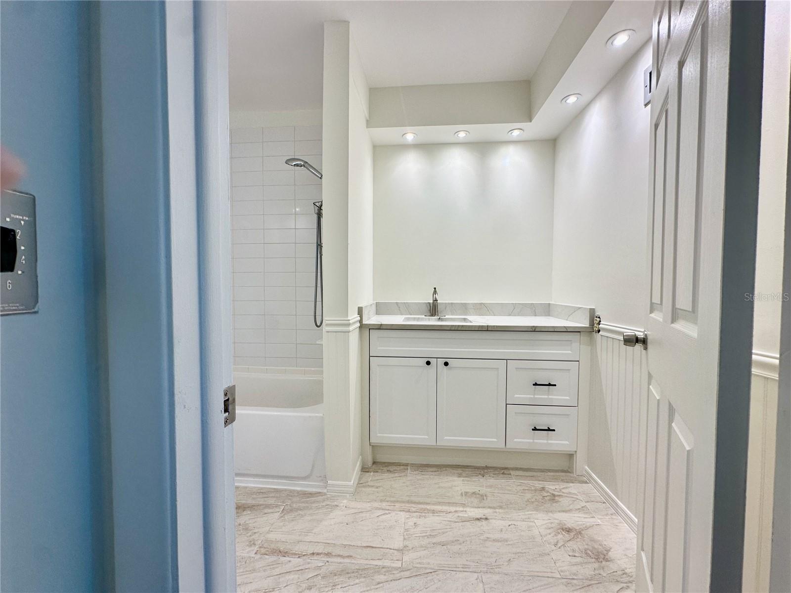 New tile floors, vanity and stone counter top
