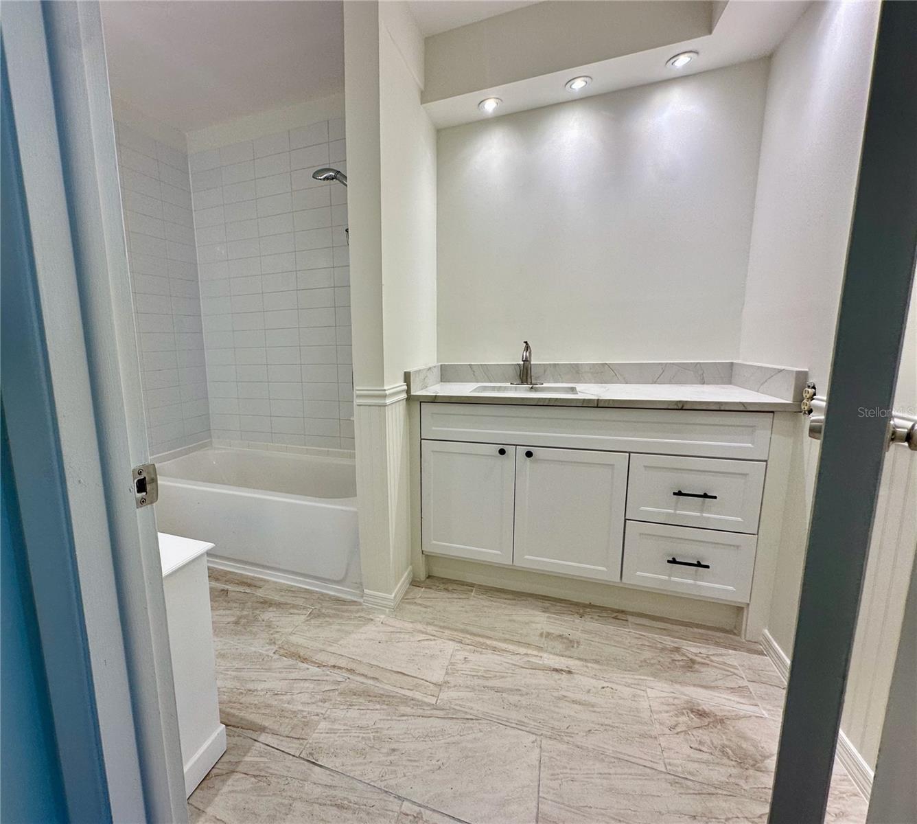 New tile floors, vanity and stone counter top
