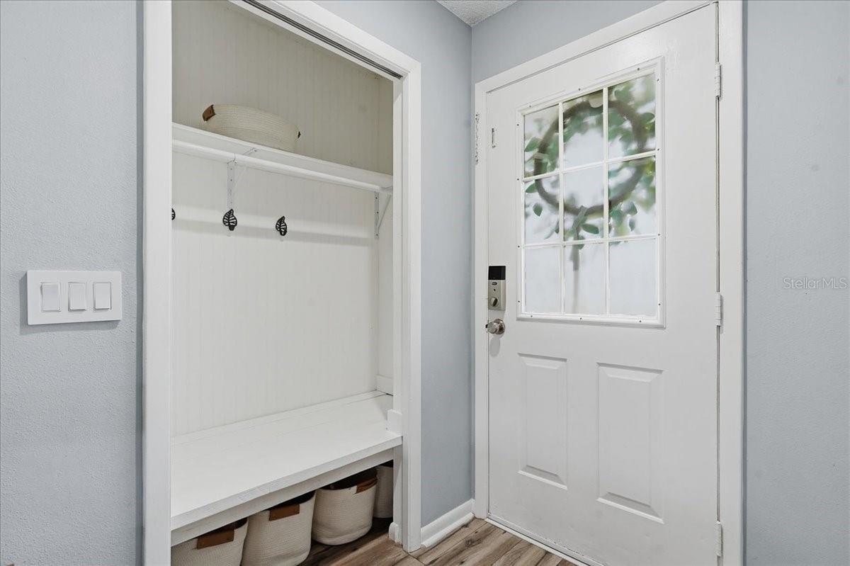 CUSTOM BUILT MUD ROOM CLOSET IN THE FOYER!