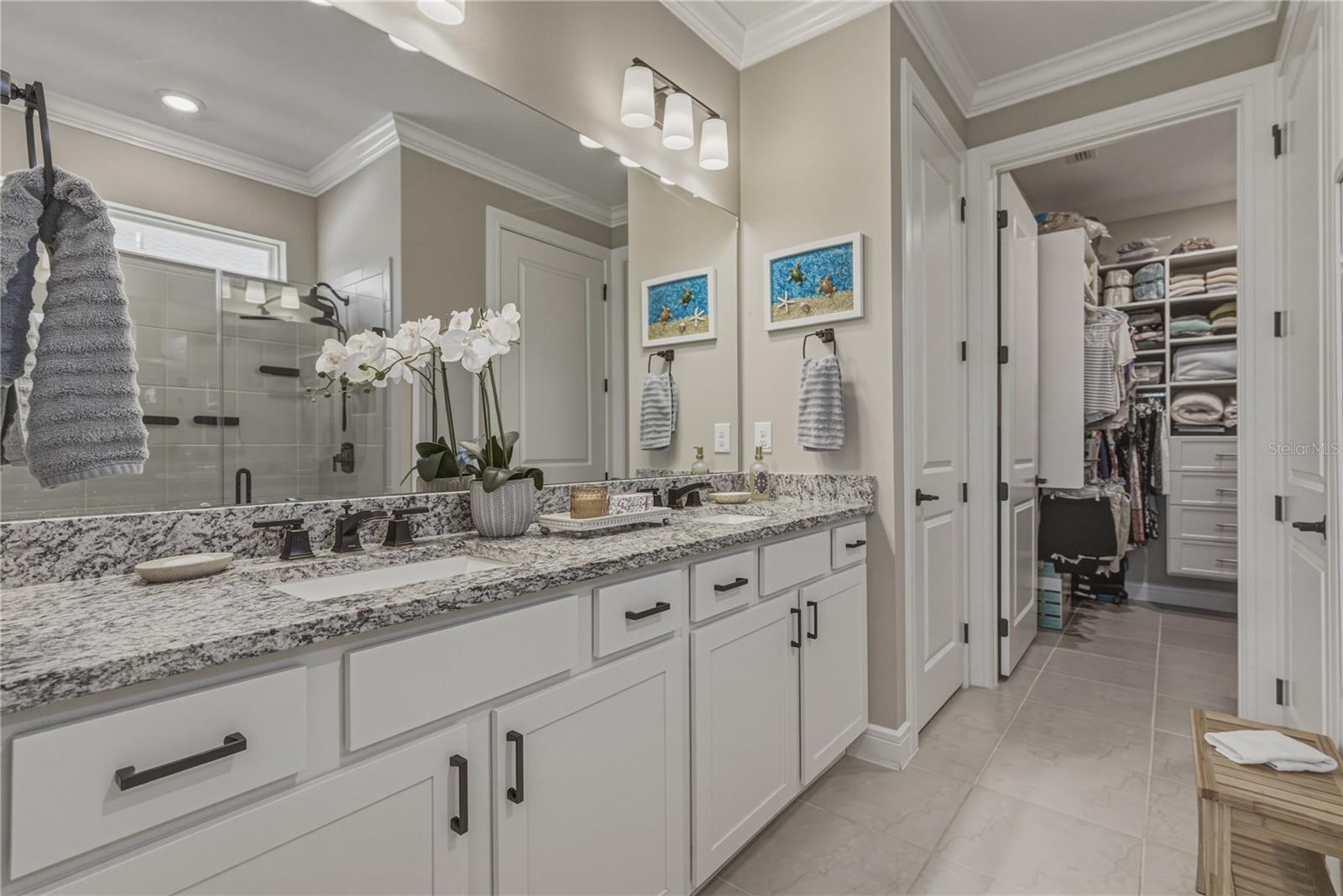 Primary Suite with upgraded Solid Wood Cabinetry, Undermount Sinks, Oversized Shower & Toilet Room