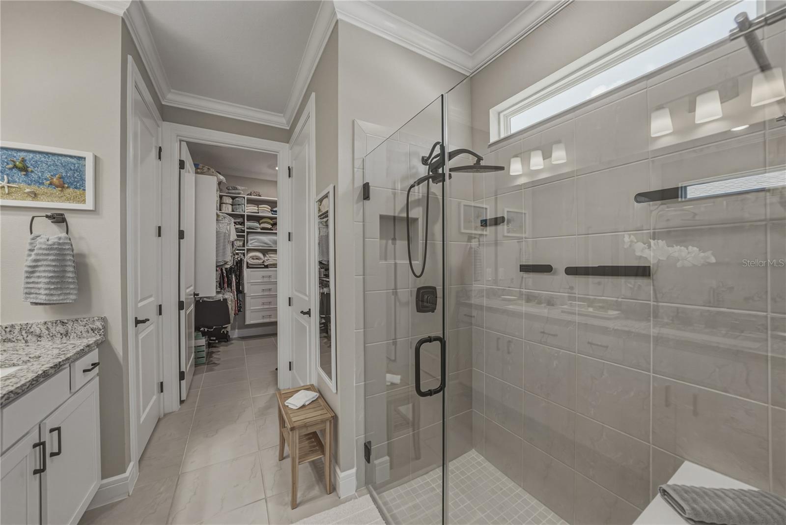 Custom Shower with Multiple Heads, Built in Shower Seat & Frameless Glass Door