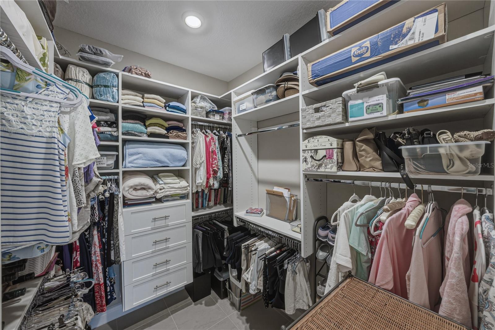 Primary Suite Walk in Closet Custom Built with California Closets