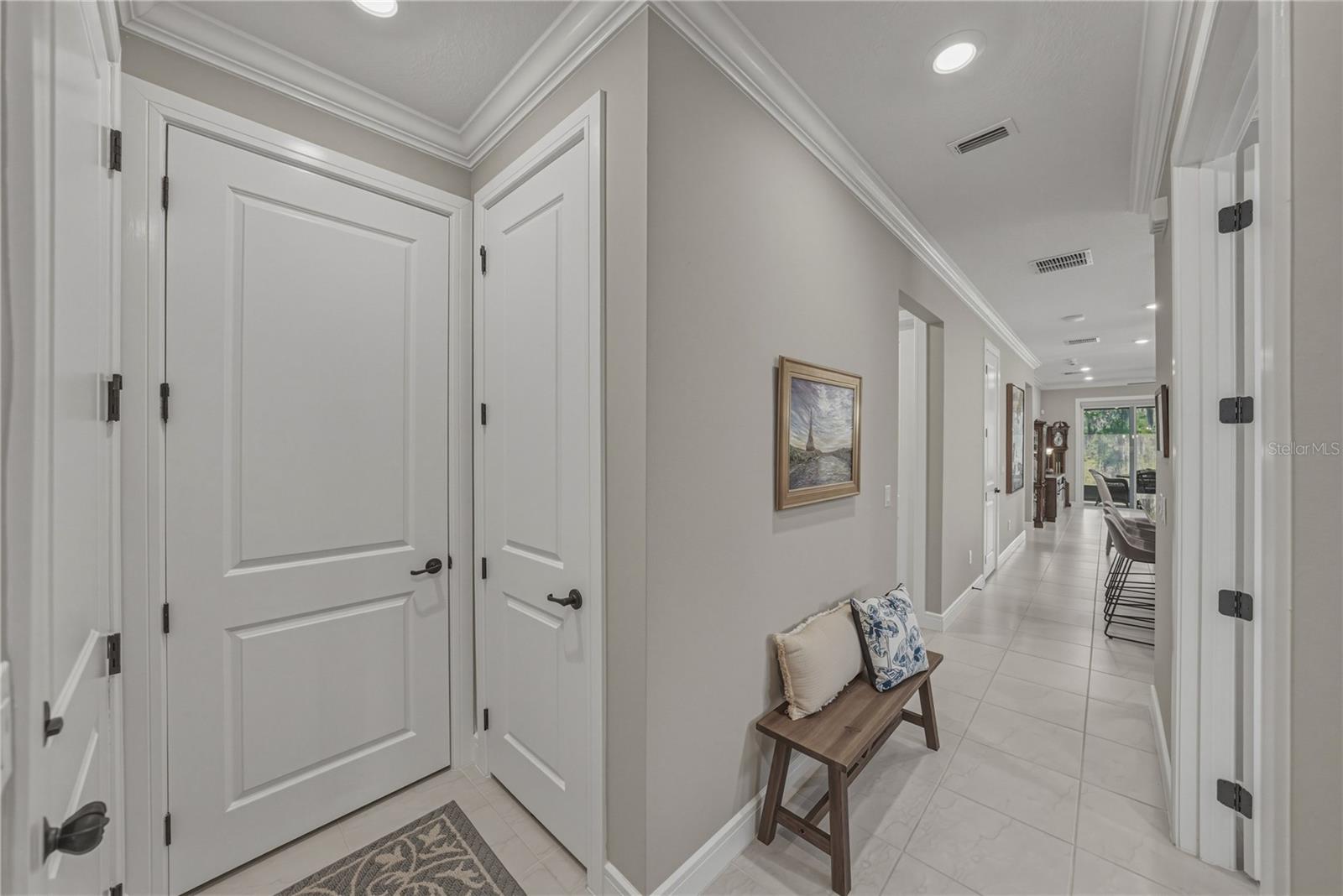 Front Entry Foyer with All 8 Foot Doors, Coat Closet, A/C Closet and access to Garage