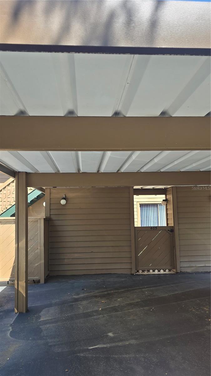 Your own designated covered parking with a gate to yout courtyard and storage room.
