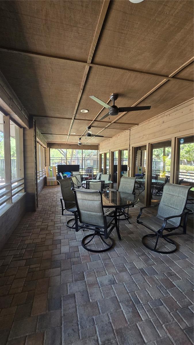 Outdoor entertainment area of the clubhouse overlooking the gorgeous pool.