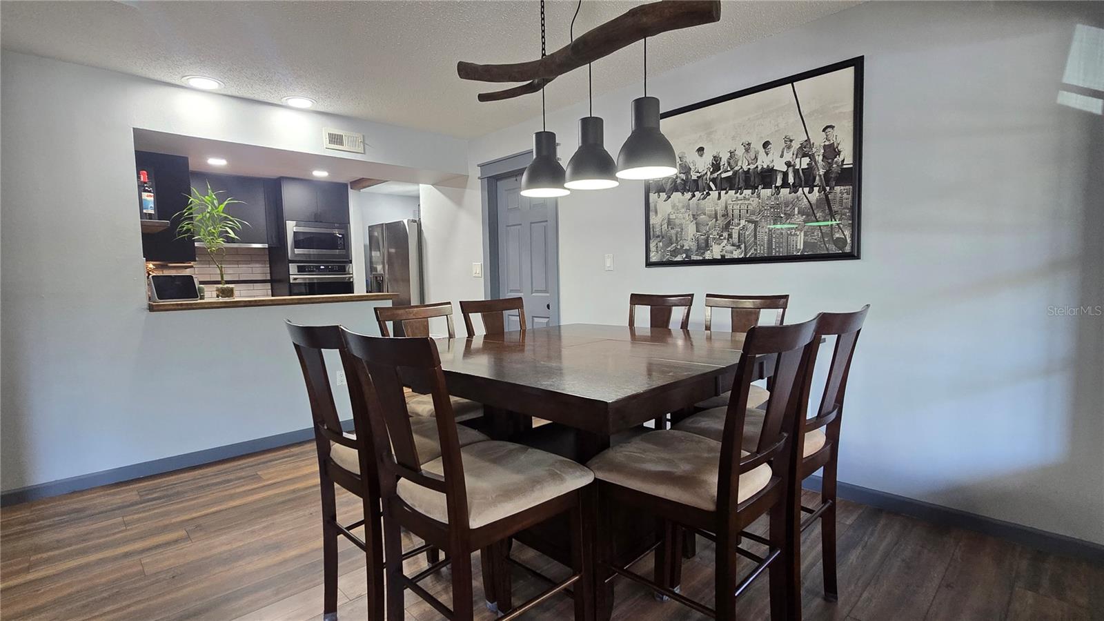 Enjoy family and friends with this great lay out for cooking, entertaining and eating.  The dining room light was hand made by an artist.