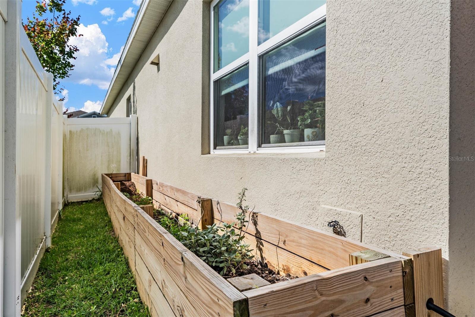 Raised garden bed on side of home!