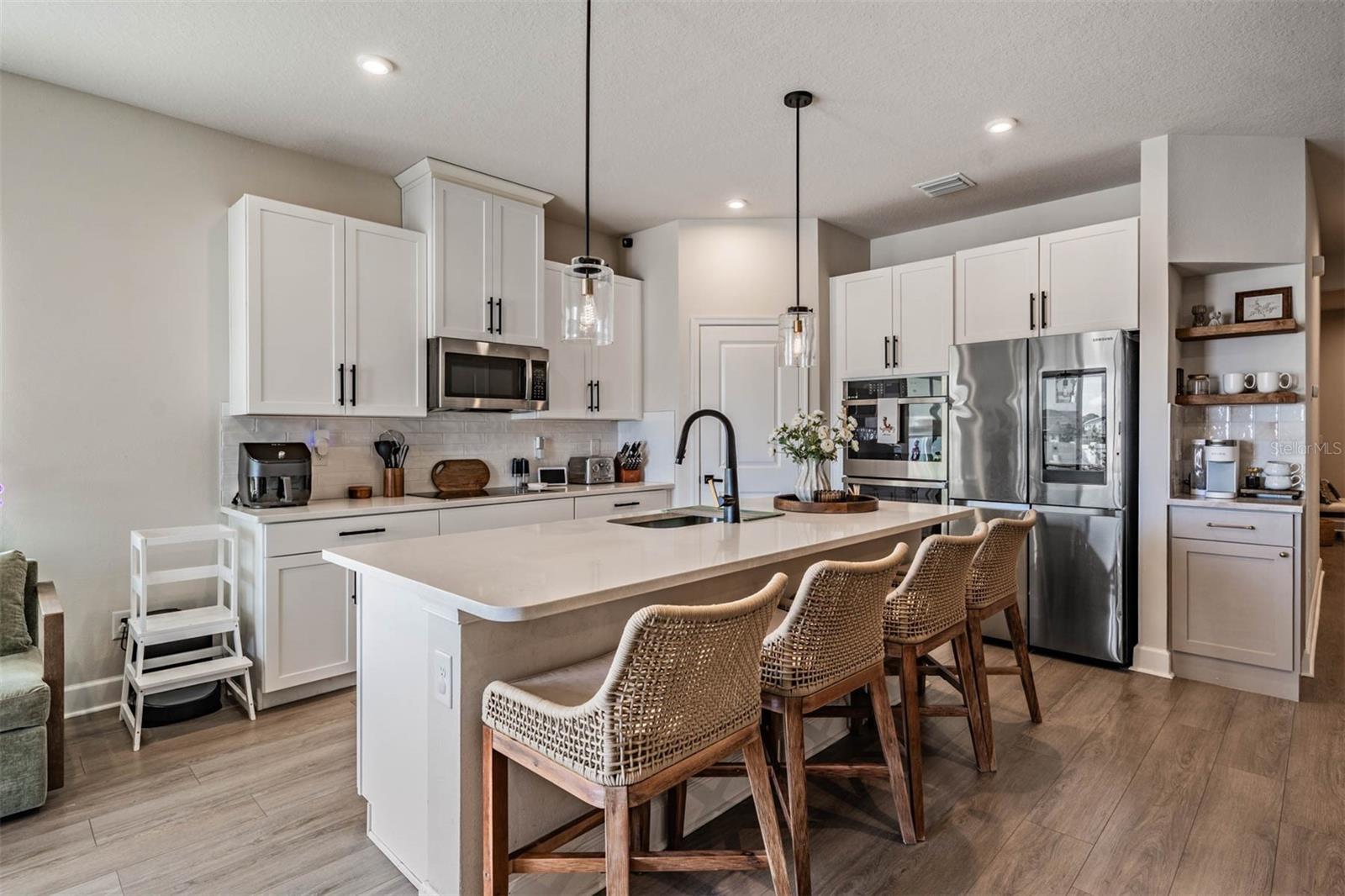 Center island overlooks Great room & dining area