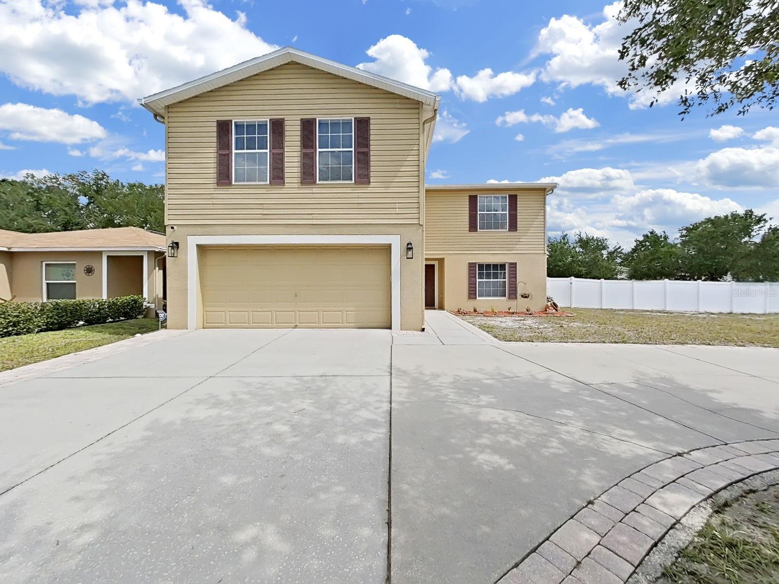 Impressive two-story Ashley Lakes home on a large corner lot and circular drive. Welcome home!
