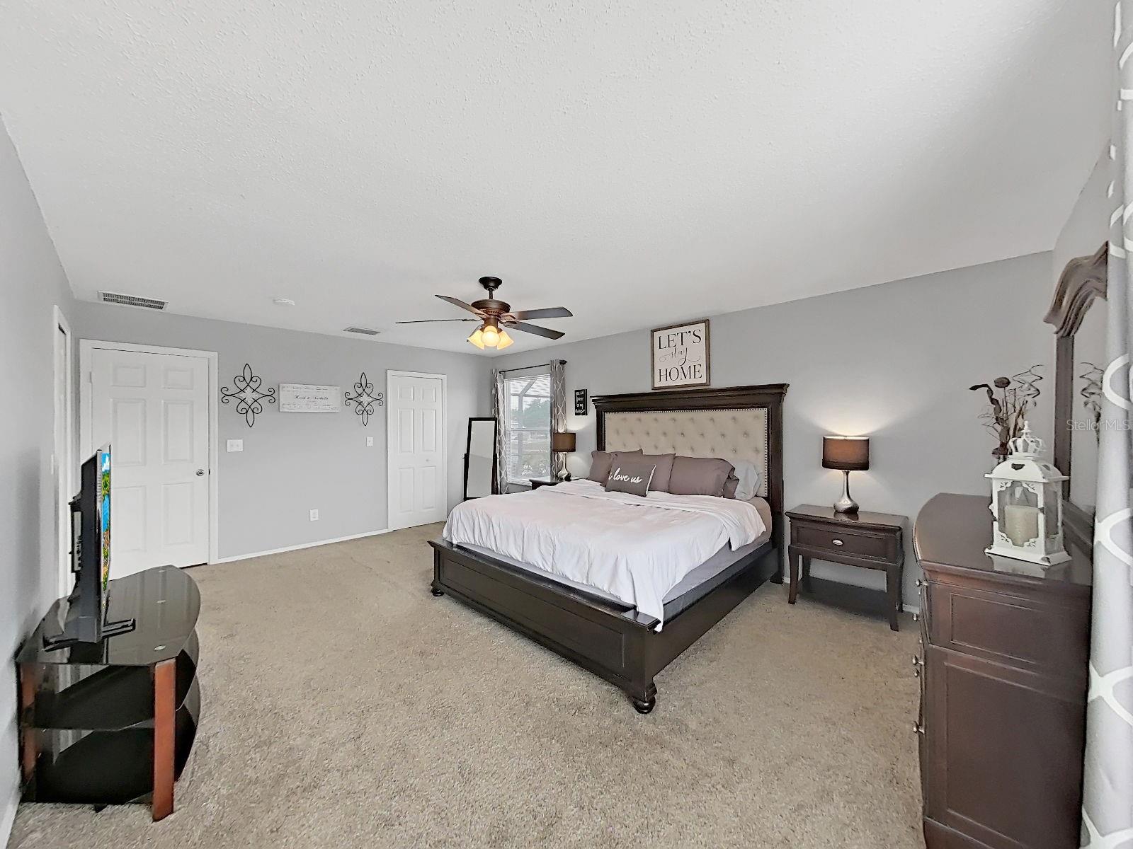 Primary Suite with dual oversized walk-in closets and plenty of room for your furniture.