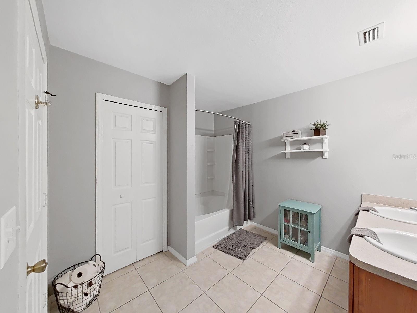 Primary Bath with soaking tub, shower, and large storage closet. A private escape!