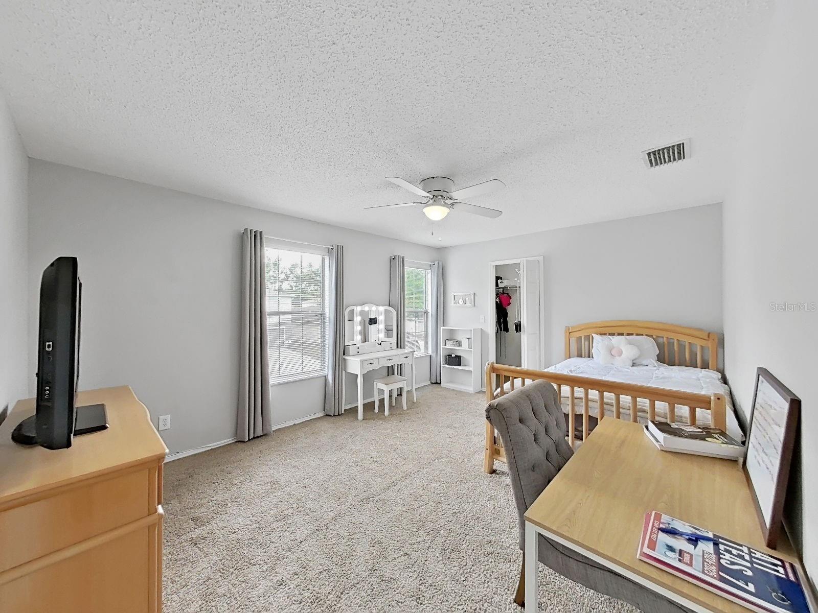 Bedroom with walk-in closet.
