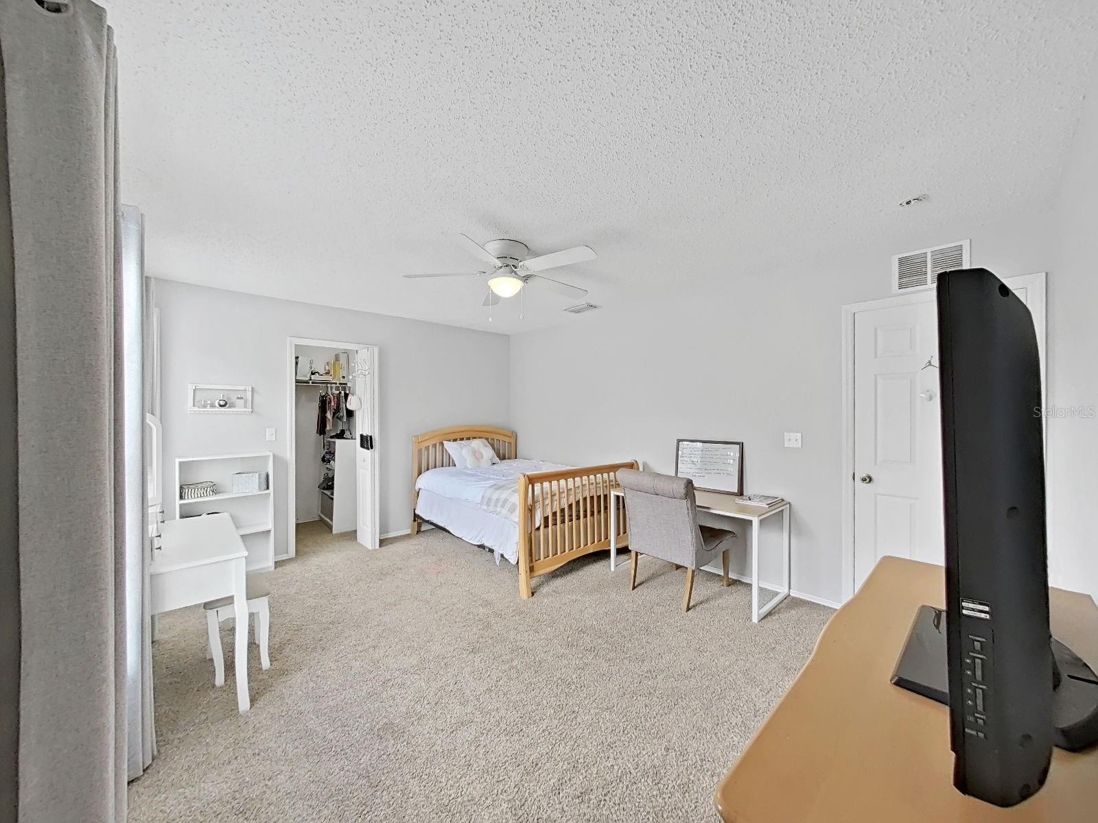 Bedroom with walk-in closet.