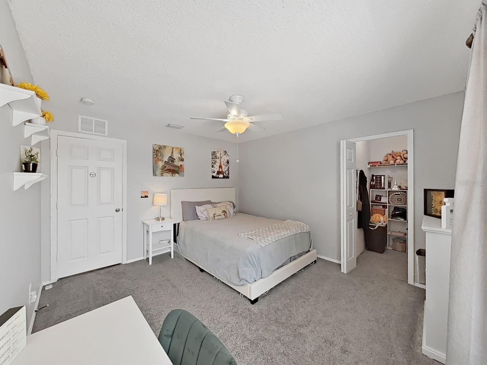 Bedroom with walk-in closet.