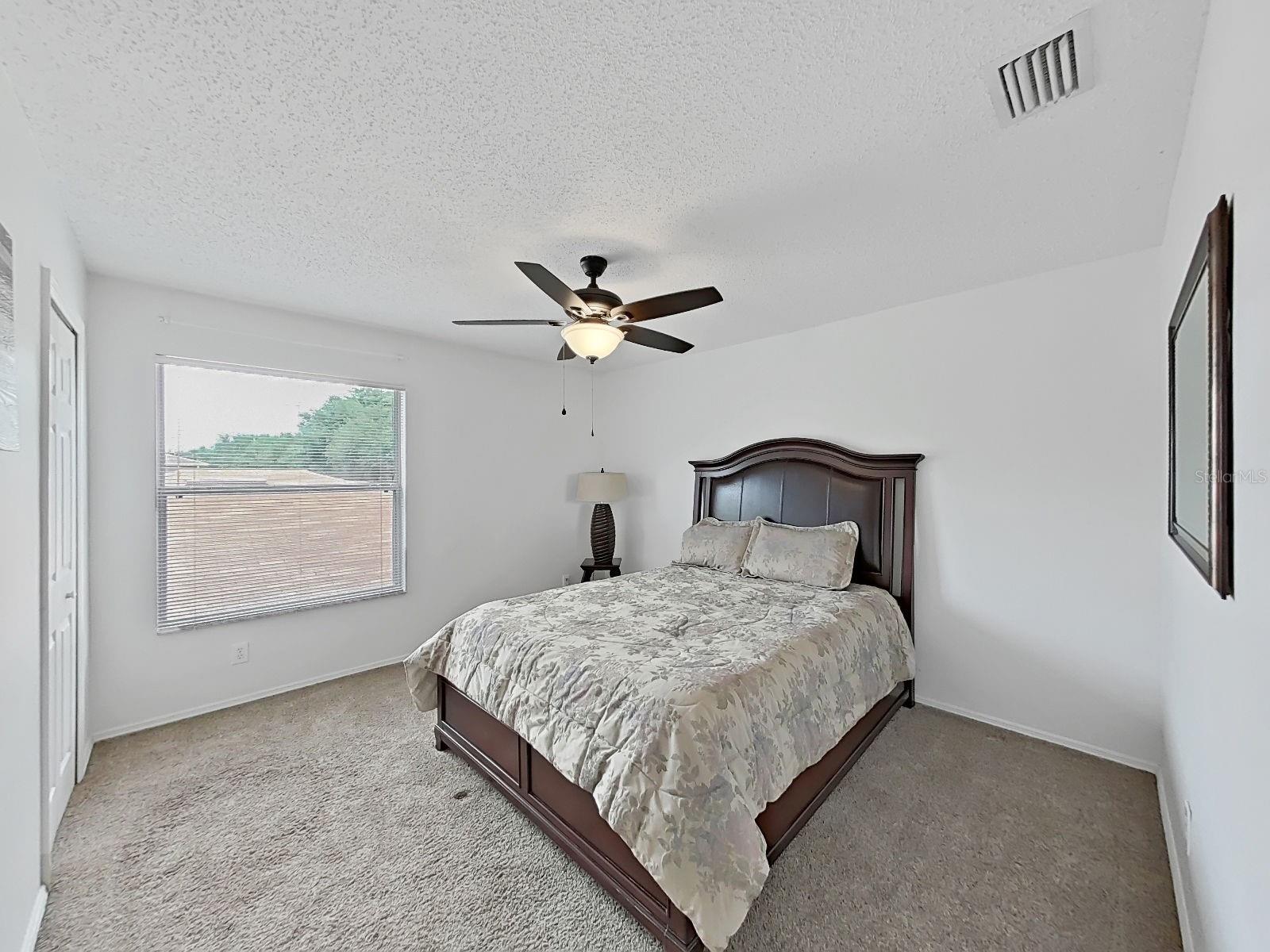 Bedroom with walk-in closet