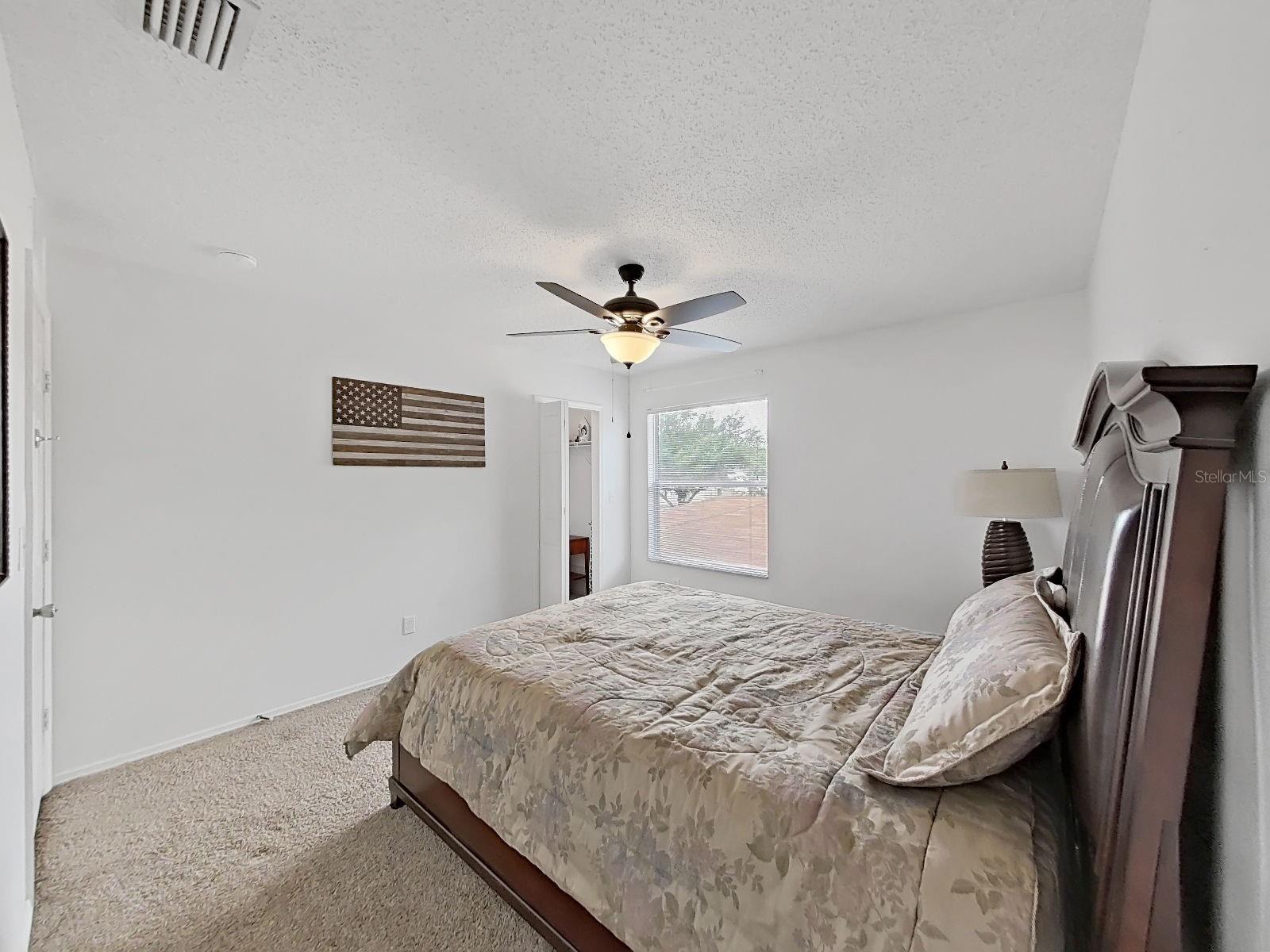 Bedroom with walk-in closet