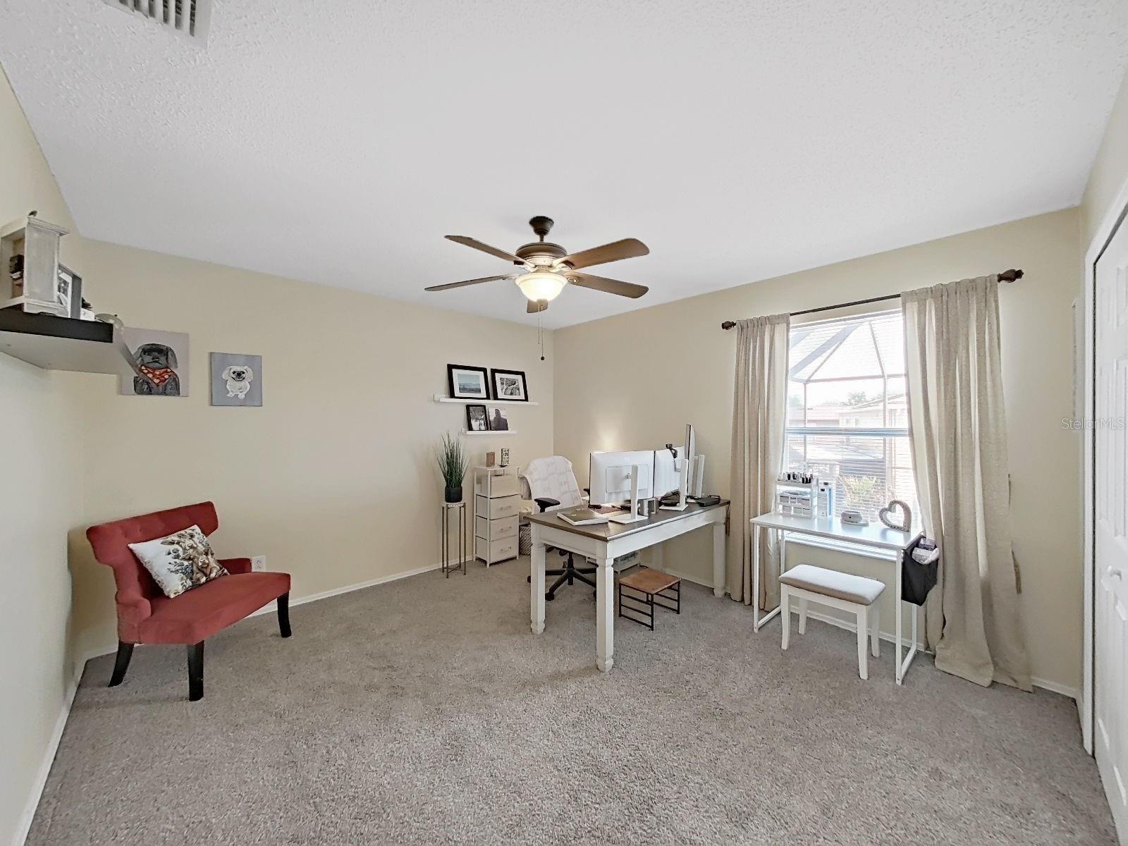 Bedroom (currently being used as office). View of the pool.