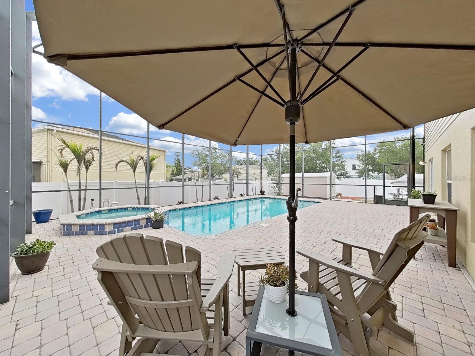 Plenty of room for seating around the expansive deck, framing the pool! Made for long Florida afternoons!