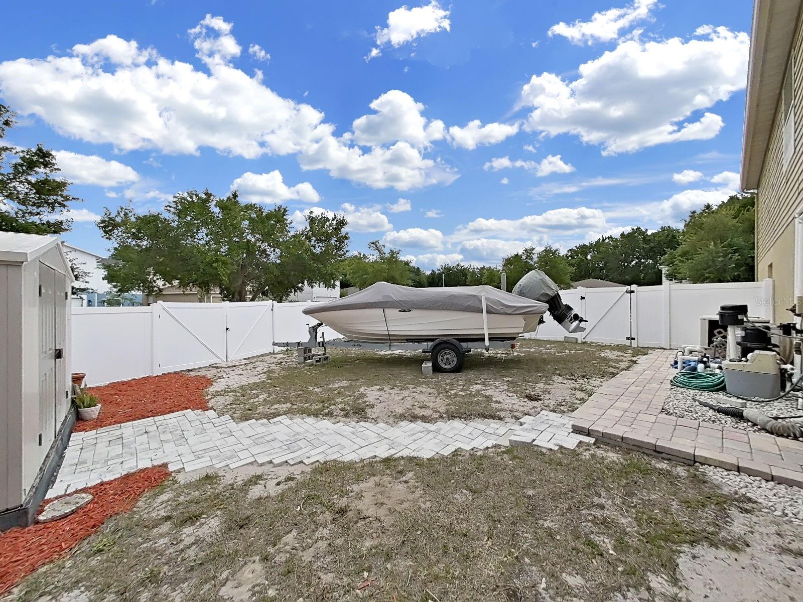 Corner lot perks include gated side yard with room to store your boat, trailer, or toys! Space to live your best Florida life!