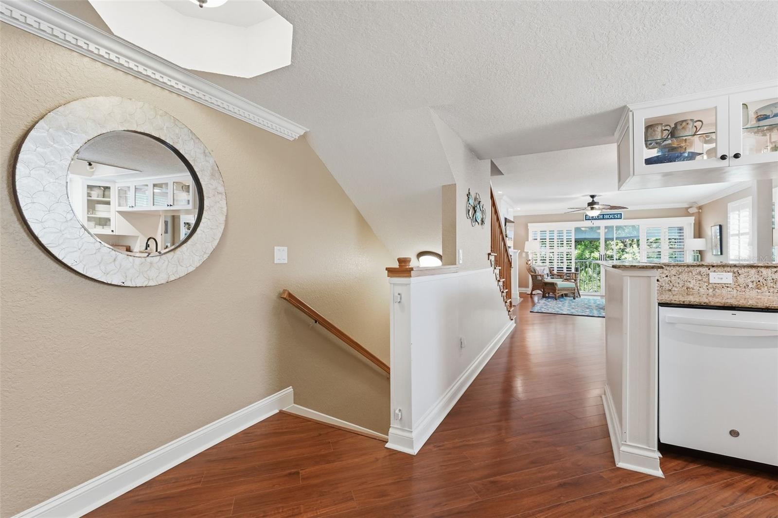 View from top of 2nd floor landing to the screened patio.
