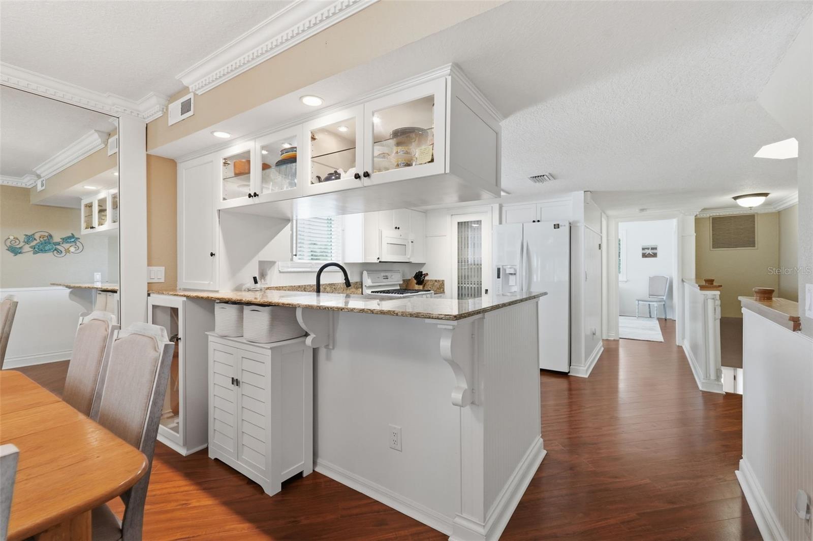 Built in glass cabinets, glass wine cabinet and upper cabinet.