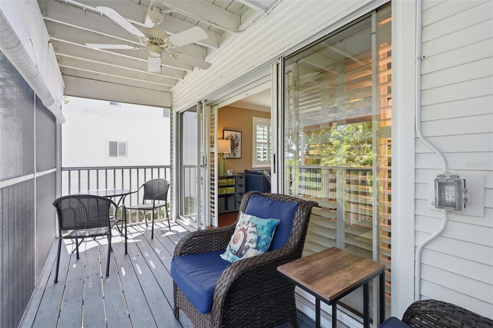 Screened Patio with ceiling fan overlooking the water.