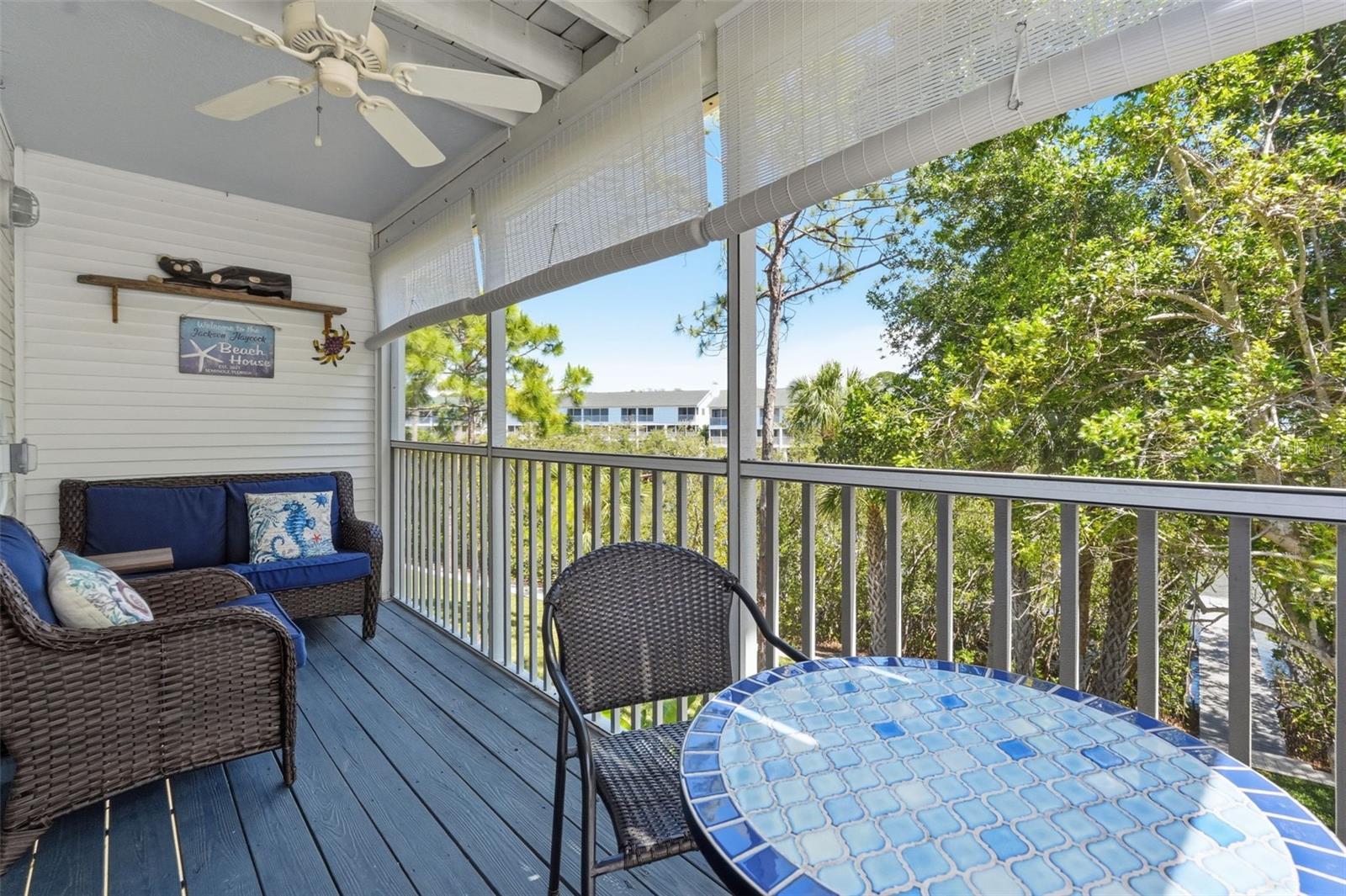Screened Patio with ceiling fan overlooking the water.