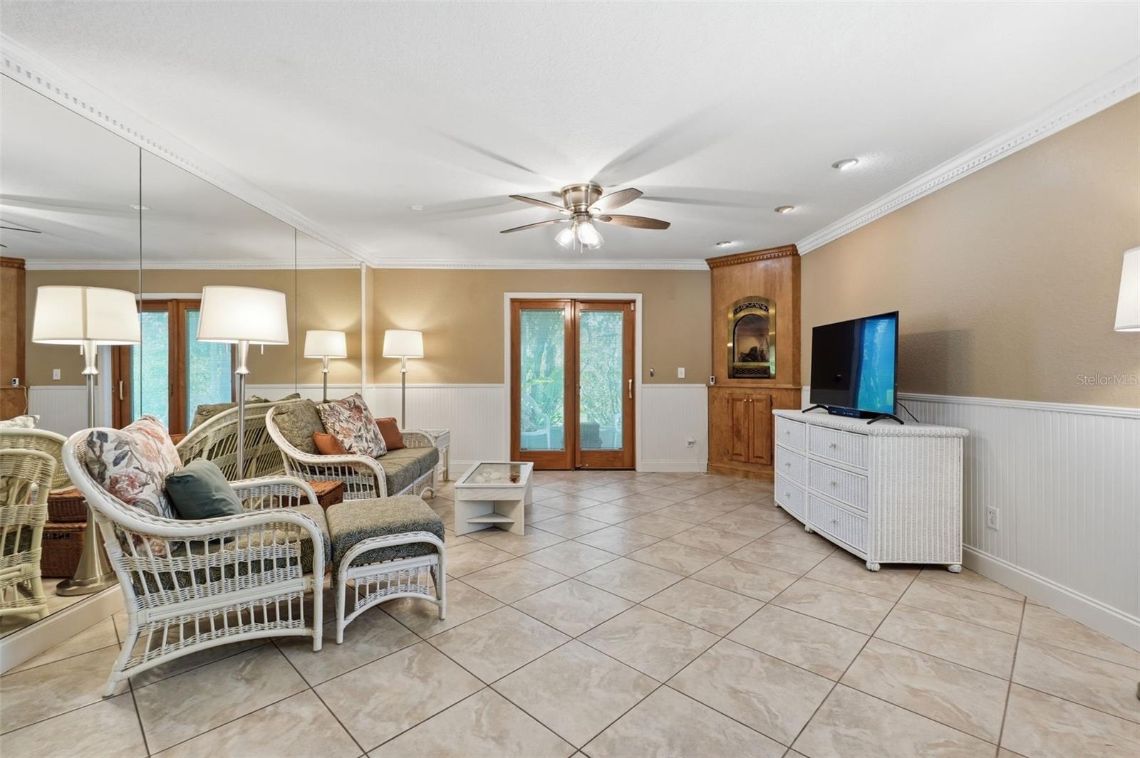 Impact Sliding Doors to 1st floor screened patio and open side patio.