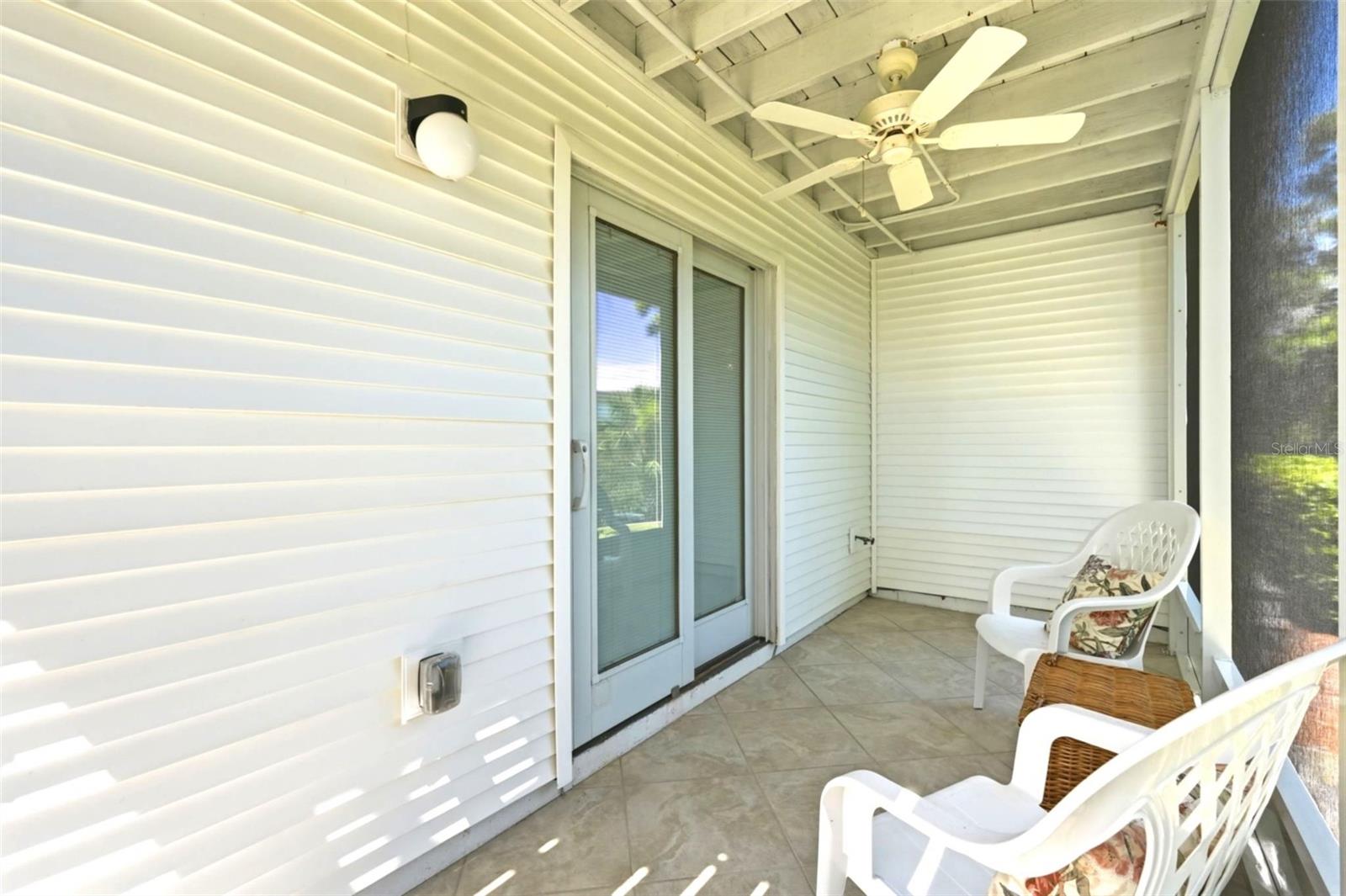 1st Floor screened patio with ceiling fan.