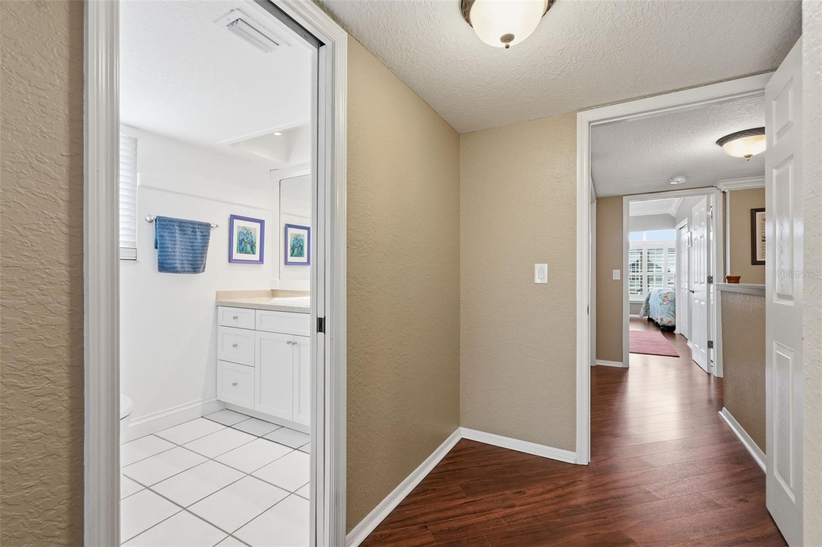 Laundry area is between the two bedrooms in the hall
