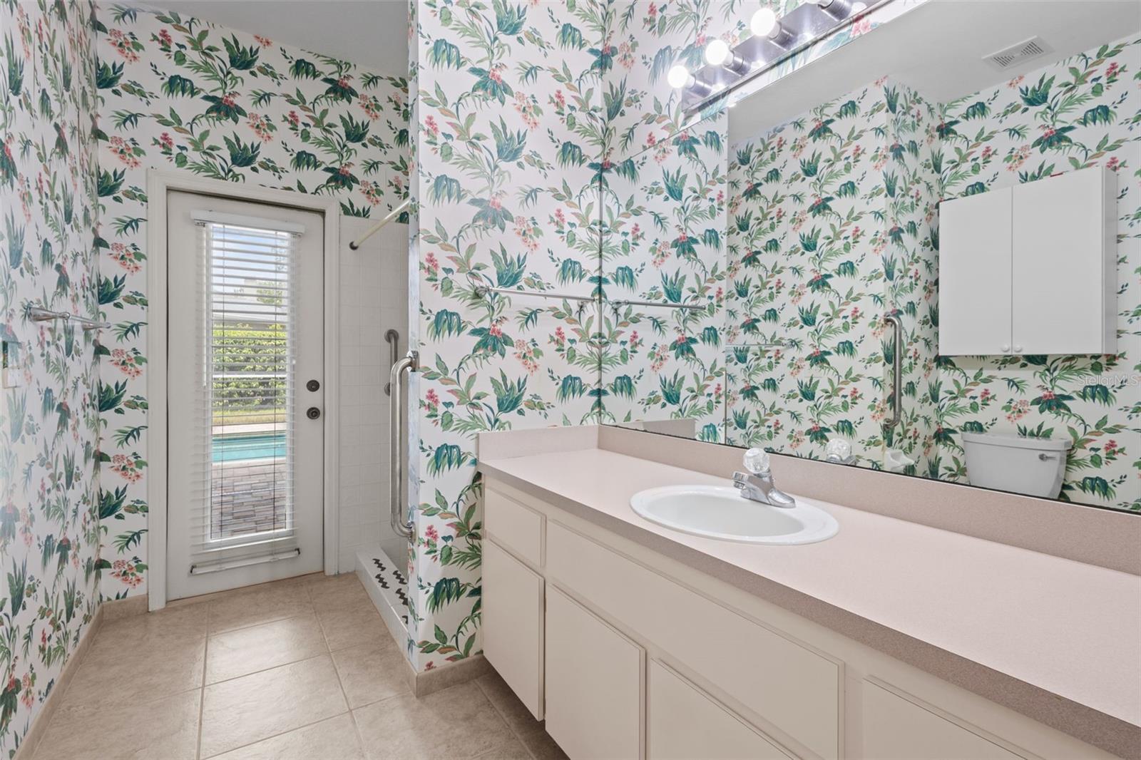 Bathroom 3 - has shower and serves as a pool bath with a door leading outside