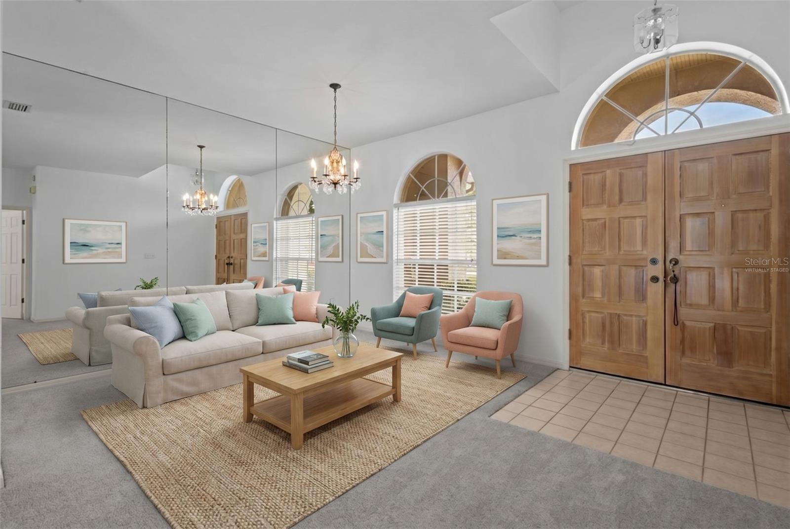 Entry opens directly into the great room with views of the pool and conservation - virtually staged