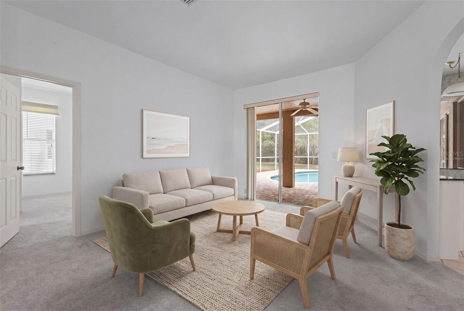 Entry opens directly into the great room with views of the pool and conservation - virtually staged